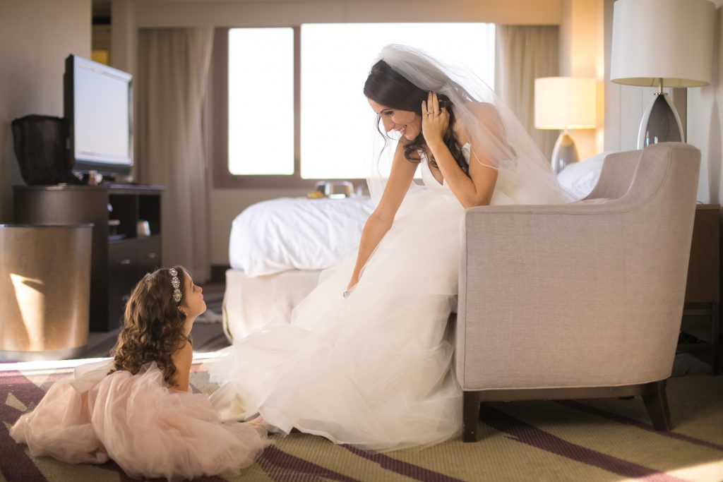 bride getting ready in hotel with daughter