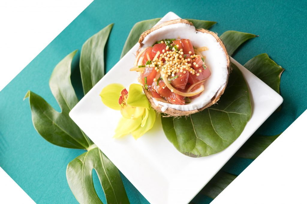 tuna poke in coconut with leaf and orchid Haliewa joes menu 