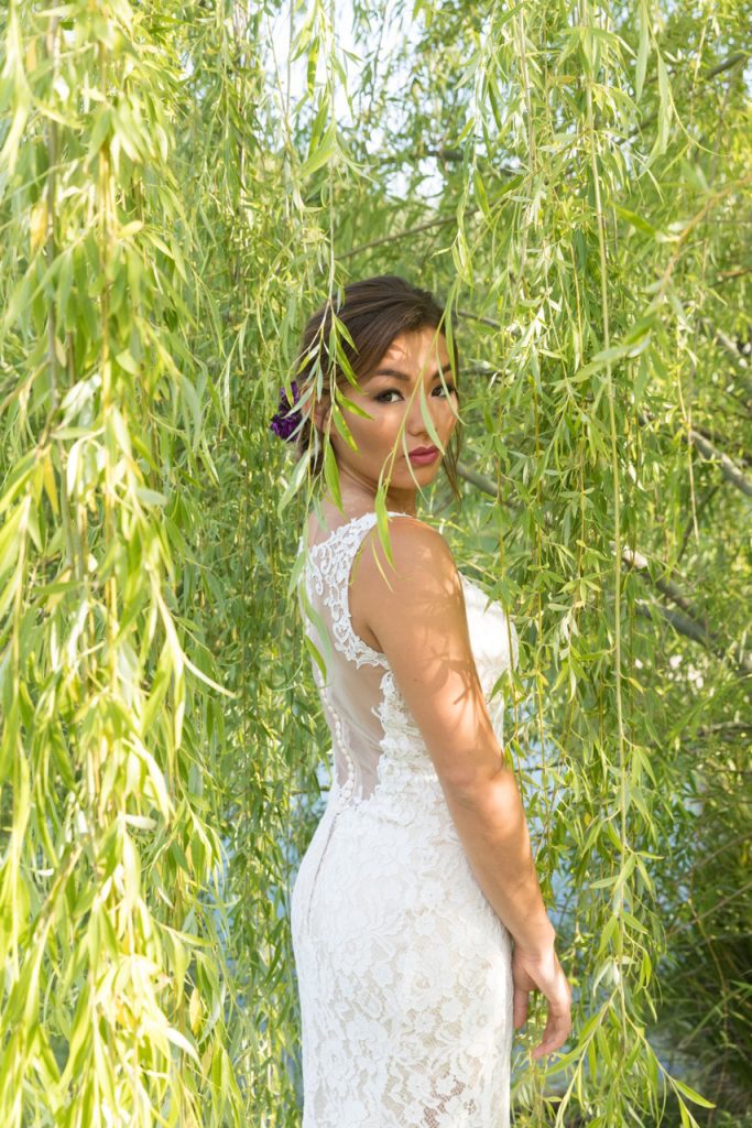 bride under tree at milagro wedding venue in Ramona, California
