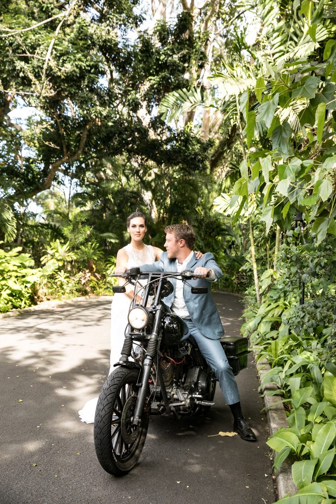 couple ride on harley motorcycle exit